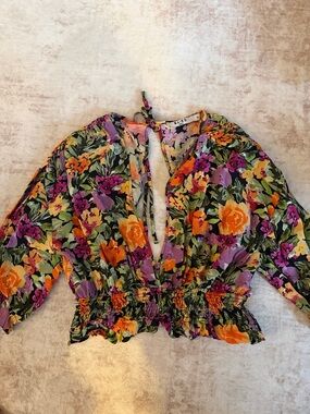 NA-KD Floral Tie-Neck Peplum Blouse in Black with Orange & Purple Blooms
